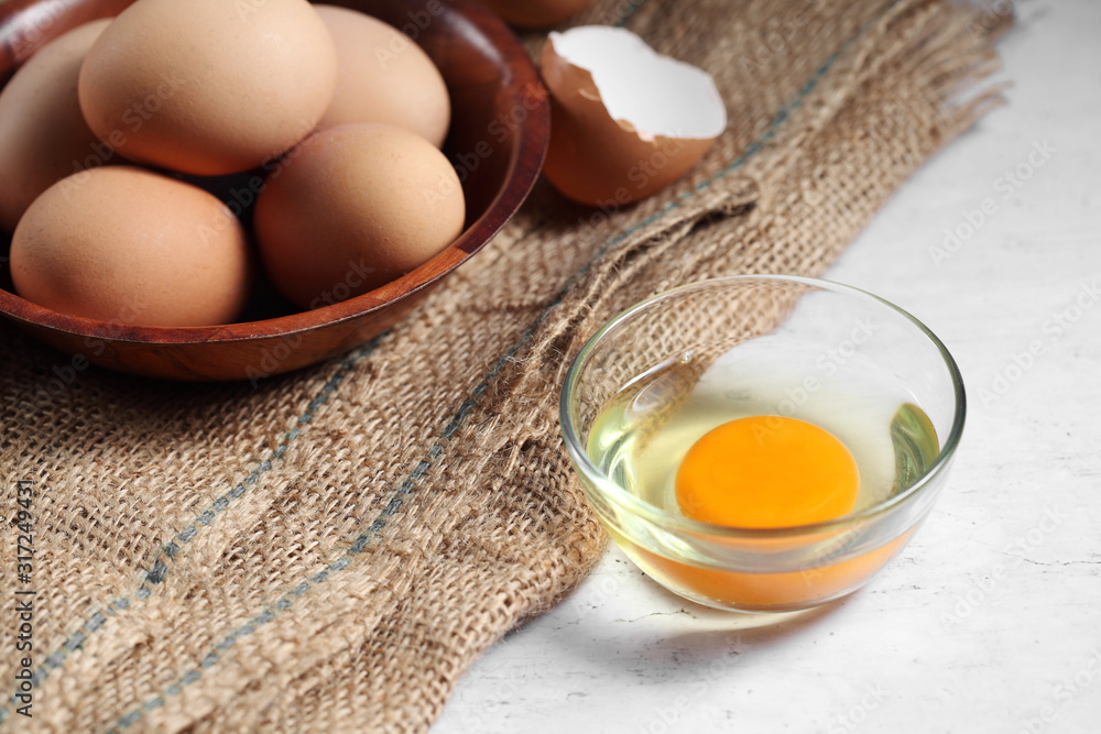Group of of raw chicken eggs on rustic background, Ingredient for Scrambled eggs in loft style kitchen Group of of raw chicken eggs on rustic background, Ingredient for Scrambled eggs in loft style kitchen