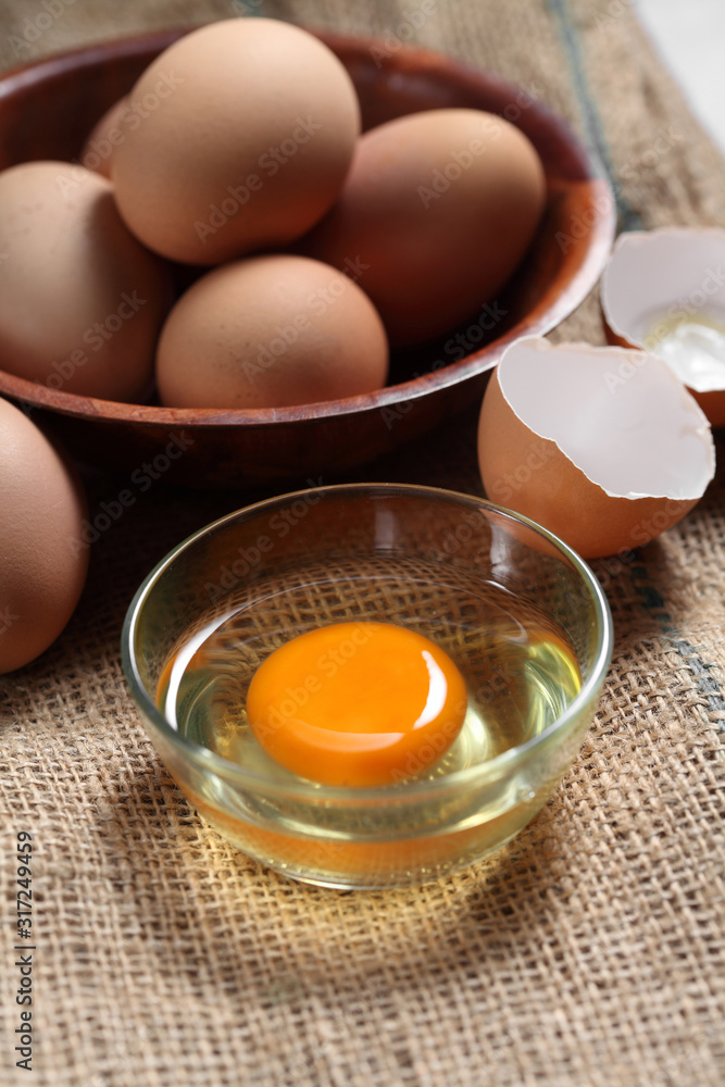 Group of of raw chicken eggs on rustic background, Ingredient for Scrambled eggs in loft style kitchen Group of of raw chicken eggs on rustic background, Ingredient for Scrambled eggs in loft style kitchen