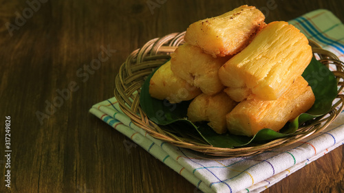 Deep fried cassava root. Brazilian Mandioca Frita (deep fried cassava/ manioc/yuca). Feijoada side dish photo