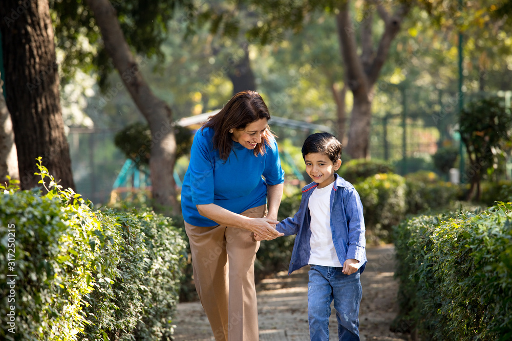Cheerful grandmother spending leisure time with grandson Cheerful grandmother spending leisure time with grandson