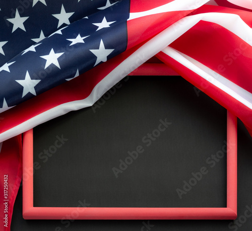 Flag of USA on black background with copy space in red frame. Concept of the patriotic holidays.