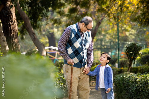 Cheerful grandfather spending leisure time with grandson © creativeimages