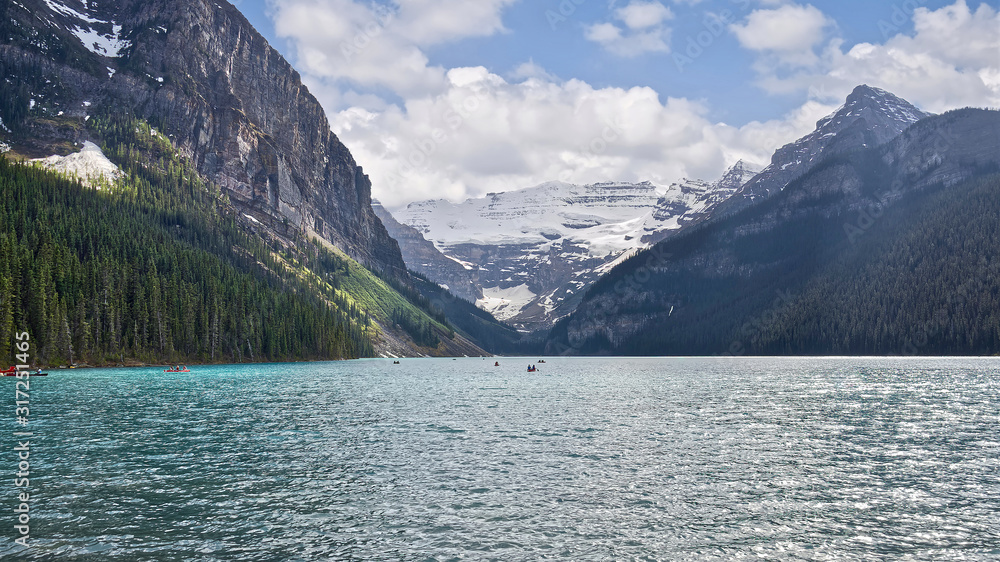 The beautiful turquoise glacial Lake Louise in Banff National Park. One of the most famous Canadian lakes