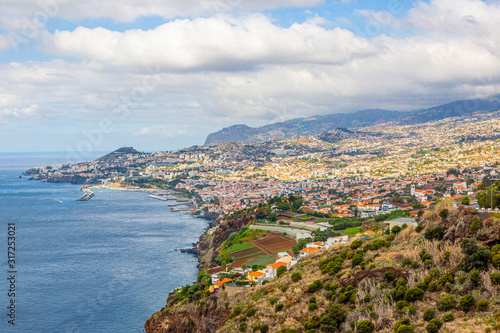 Panoramic picture over the capitol city of Funchal on the Portugese island of Madeira at daytime
