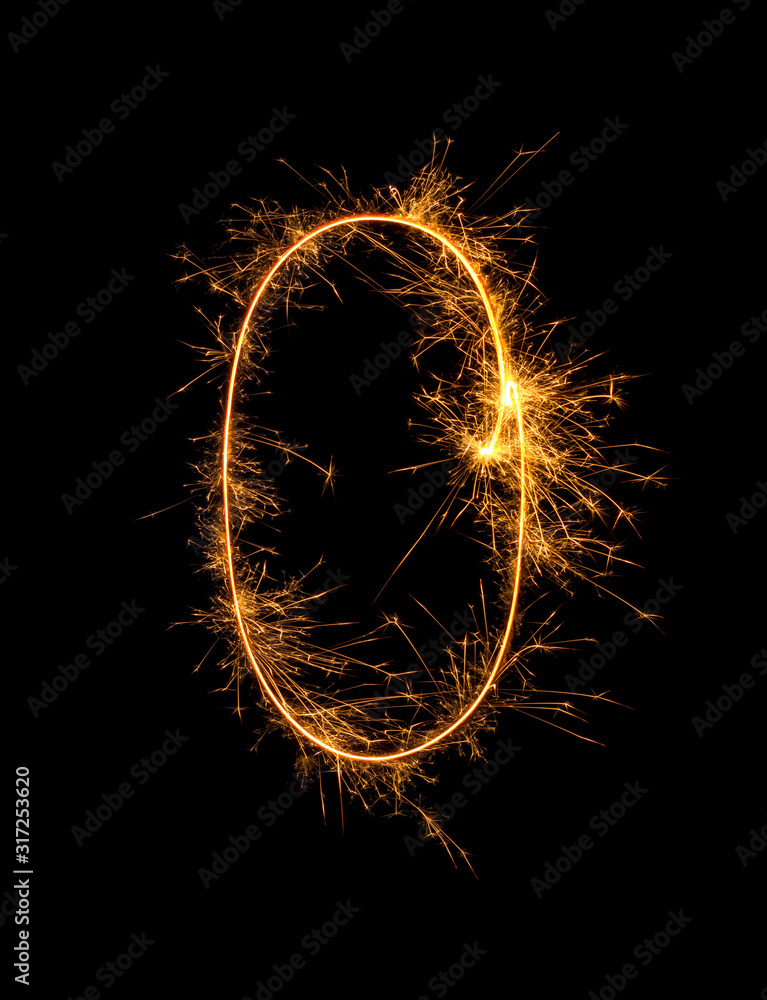 Digit 0 or zero made of bengal fire, sparkler fireworks candle isolated on a black background. Party dark backdrop