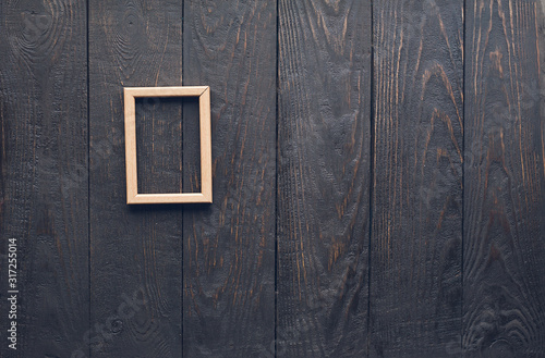 photo frame on old wooden wall