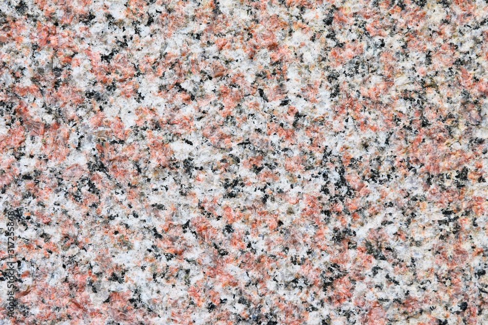 Structured granite surface with selective focus. Stone background with rough texture. Natural unpolished stone. Building materials. Marble Structured granite surface with selective focus. Stone background with rough texture. Natural unpolished stone. Building materials. Marble