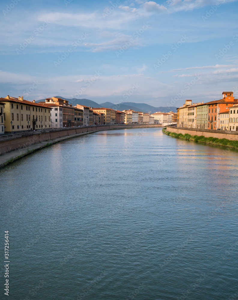 Beautiful Italian city landscape with a wide canal, ancient architecture at sunset