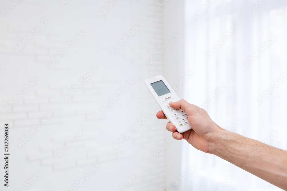 Hand holding a remote control Hand holding a remote control