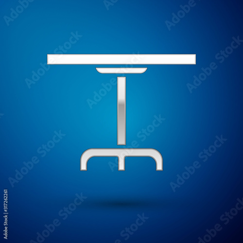 Silver Round table icon isolated on blue background. Vector Illustration
