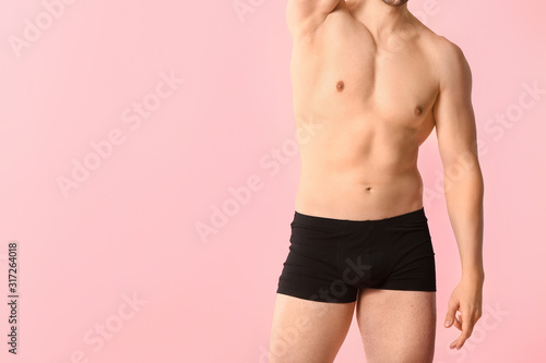 Handsome man in underwear o...