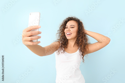 Beautiful young woman takin...