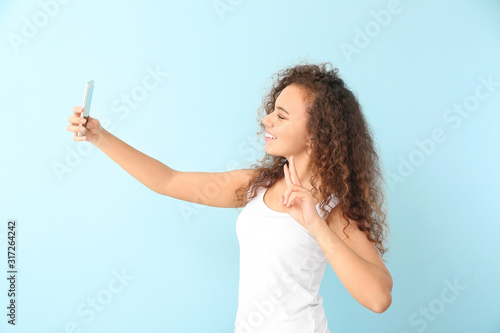 Beautiful young woman takin...