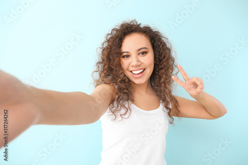 Beautiful young woman takin...