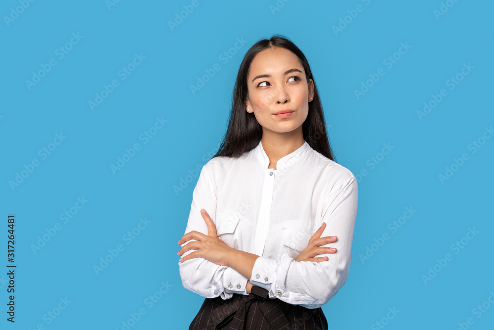 Freestyle. Young woman wearing shirt and skirt standing isolated on blue crossed arms thinking of creative idea smiling joyful Freestyle. Young woman wearing shirt and skirt standing isolated on blue crossed arms thinking of creative idea smiling joyful