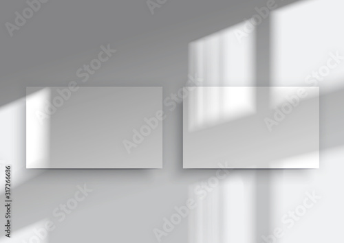 Two business cards. Overlay shadow from the window © radionastya