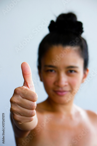 Young Woman Thumbs Up