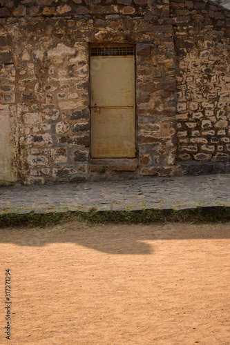 Vászonkép Door on Granite Stone Wall