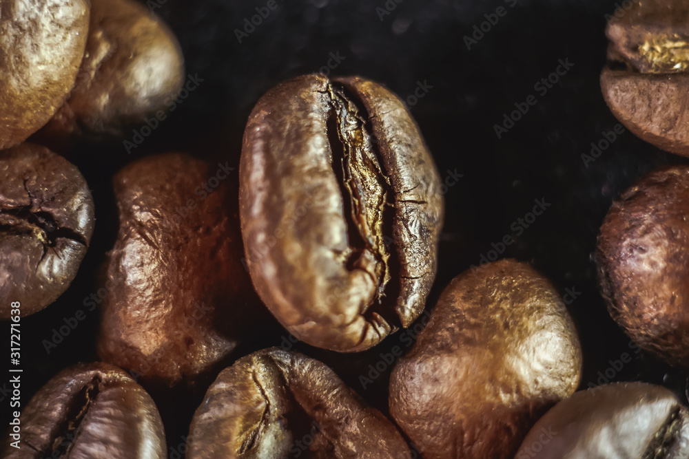 Fototapeta premium coffee grains close-up on a black background.