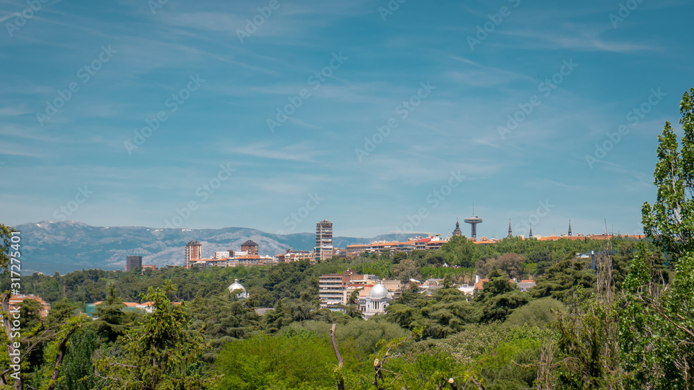 Panoramic view of the downtown Madrid with Moncloa tower from the famous park Las Vistillas in Spain on a sunny day during the traditional festival in May called San Isidro in the capital of Spain