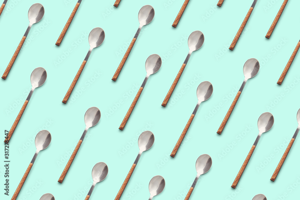 Pattern of a modern stylish spoons on colored background. Spoon isolated Pattern of a modern stylish spoons on colored background. Spoon isolated