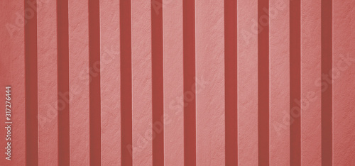 background and texture of the pink concrete wall with stripes
