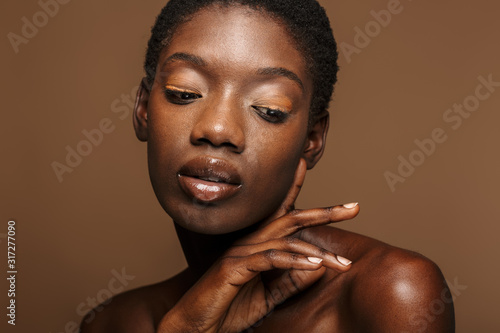 Beauty portrait of young half-naked african woman with short black hair
