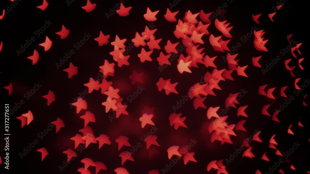 Red star shaped Bokeh at real fireworks, night background. Red star shaped Bokeh at real fireworks, night background.