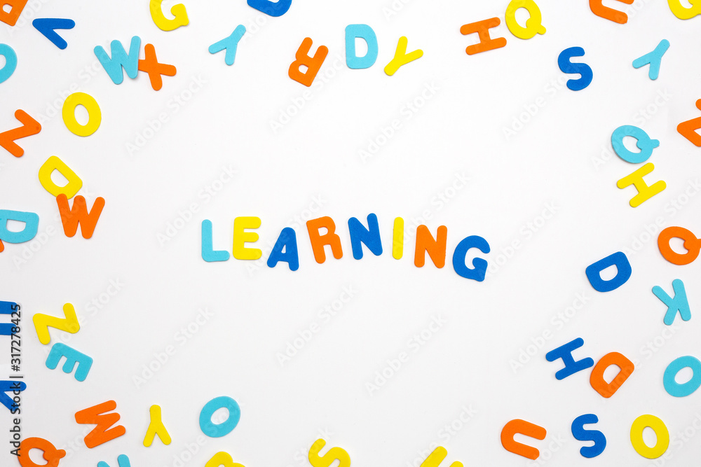Colorful letters and the word learning on white background, learning or study concept