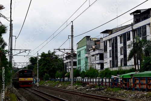 the atmosphere of the railroad tracks, right when the train comes near the mangga dua station, Jakarta, Indonesia in 2020