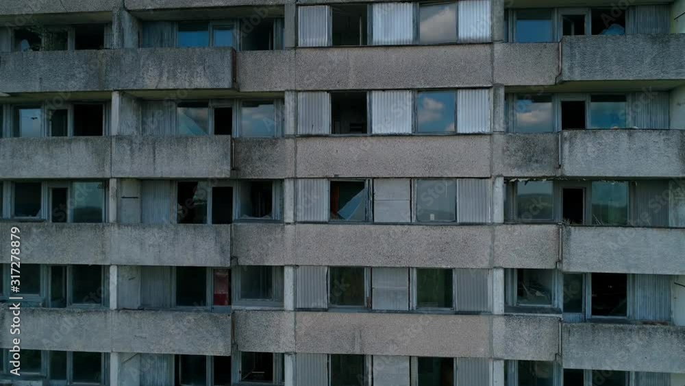 Aerial view of abandoned building in city Pripyat near Chernobyl nuclear power plant. Exclusion Zone. Camera is rises up. 4K drone footage.