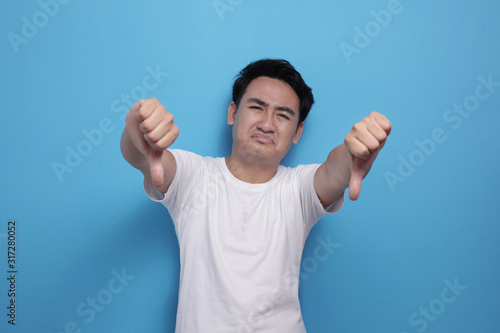 Young Man Showing Thumbs Down