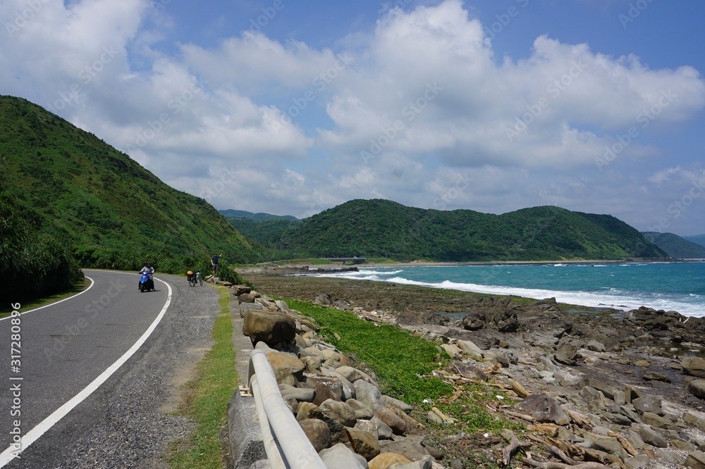 Small road along the coastline, beautiful view of the landscape, ocean and mountains