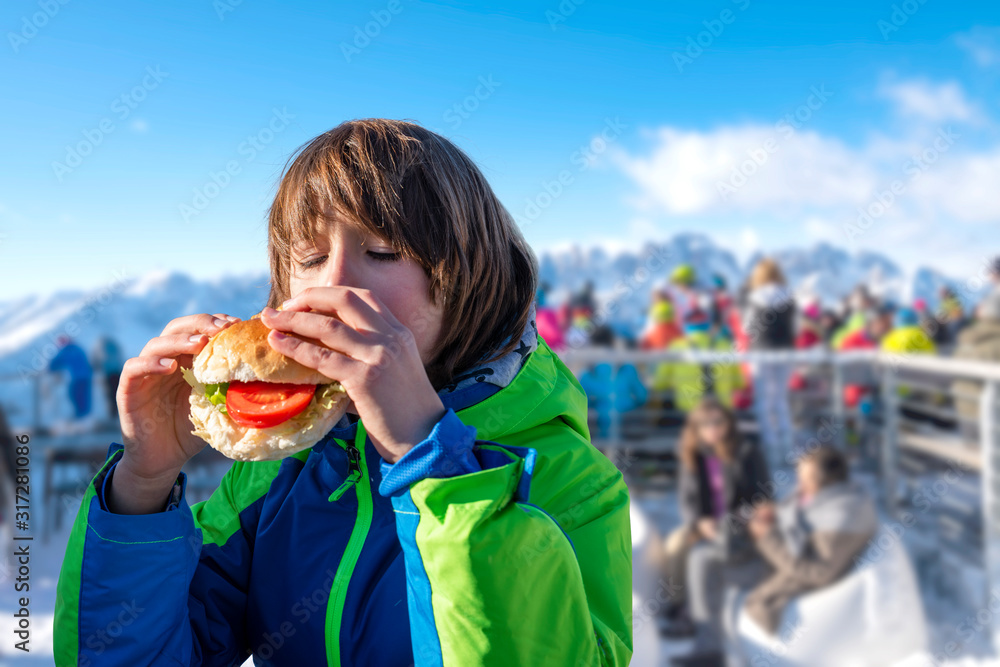 Child eating a steak with french fries Child eating a steak with french fries