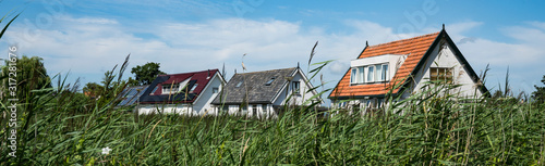 Houses along dike, in place called  Broek op Langedijk, The Netherlands photo