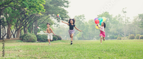 Wallpaper Mural group of kids running in the spring field at public park Torontodigital.ca