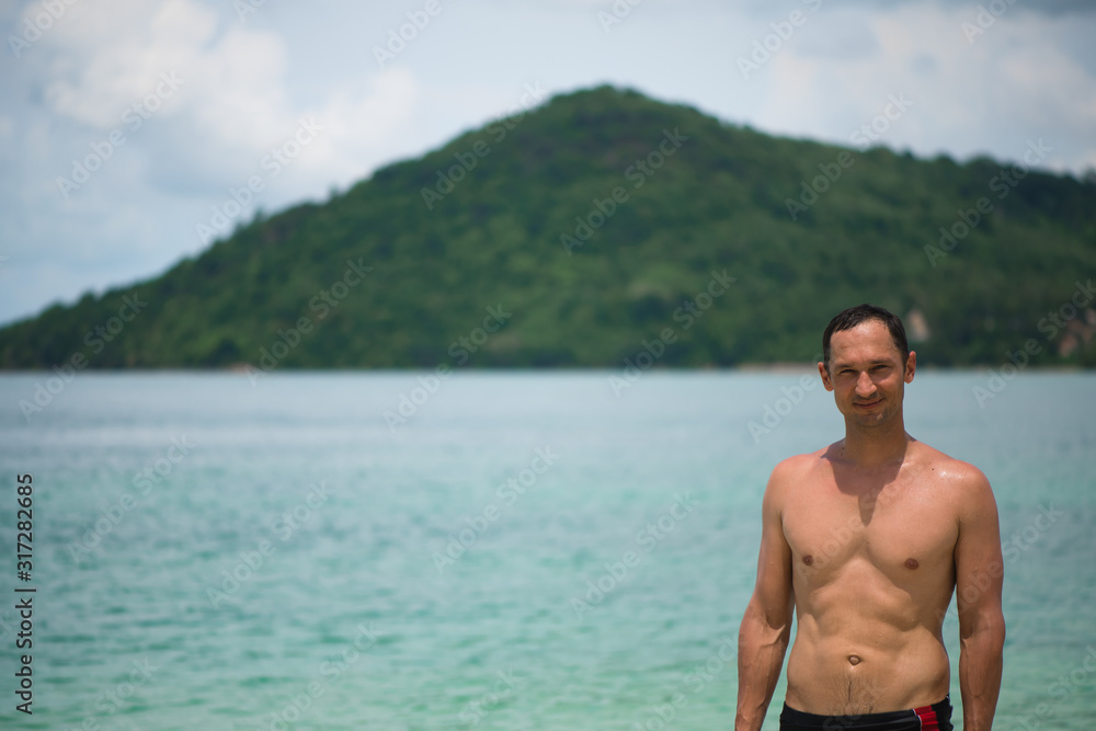 Portrait of a handsome happy man at tropical resort with smile Portrait of a handsome happy man at tropical resort with smile