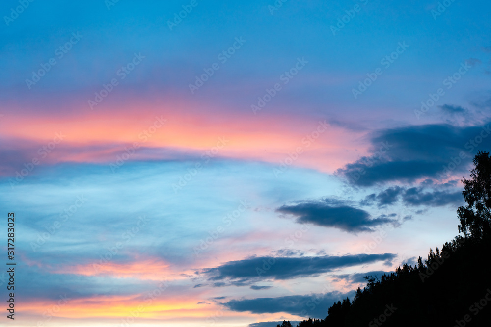 Blue and pink clouds at sunset. Colorful sky after sunset