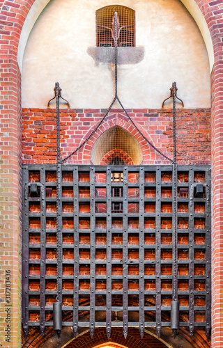 Medieval Teutonic Order Castle in Malbork, Poland - Middle Castle fortress gate tower within the inner defense walls photo