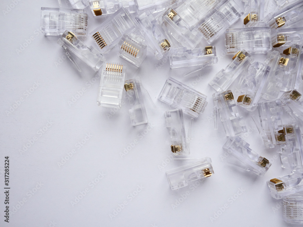 Closeup of the ethernet RJ45 installing connectors on a white background Closeup of the ethernet RJ45 installing connectors on a white background