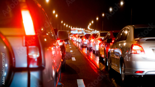  Blurred traffic jam on express way and car brake light in bangkok, thailand on night and copy space
