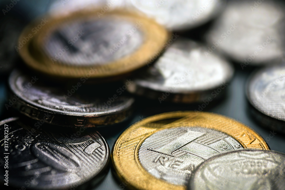 closeup of one real coin, money from brazil. Savings and savings coin. closeup of one real coin, money from brazil. Savings and savings coin.
