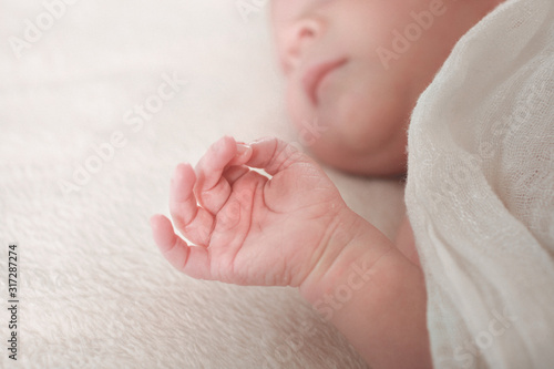 Baby sleeping holding hand
