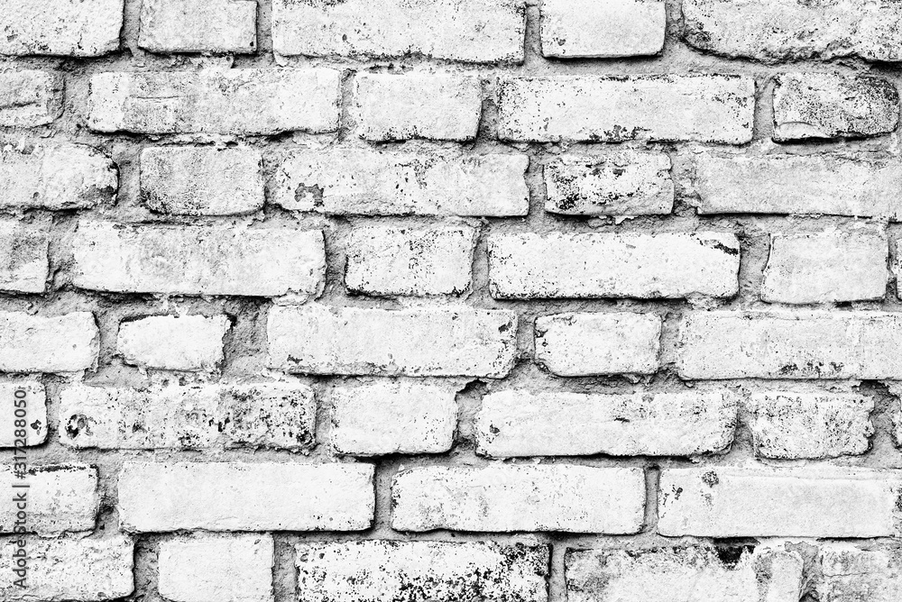 Texture of a brick wall with cracks and scratches which can be used as a background Texture of a brick wall with cracks and scratches which can be used as a background