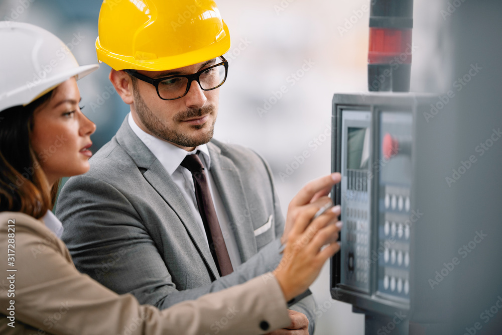 Architects working on construction project. Man and woman discussing work. Architects working on construction project. Man and woman discussing work.