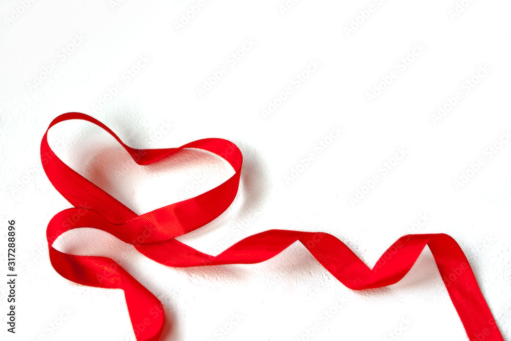 Valentines day holiday blank greeting card heart made of red satin ribbon on white background. Valentines day holiday blank greeting card heart made of red satin ribbon on white background.