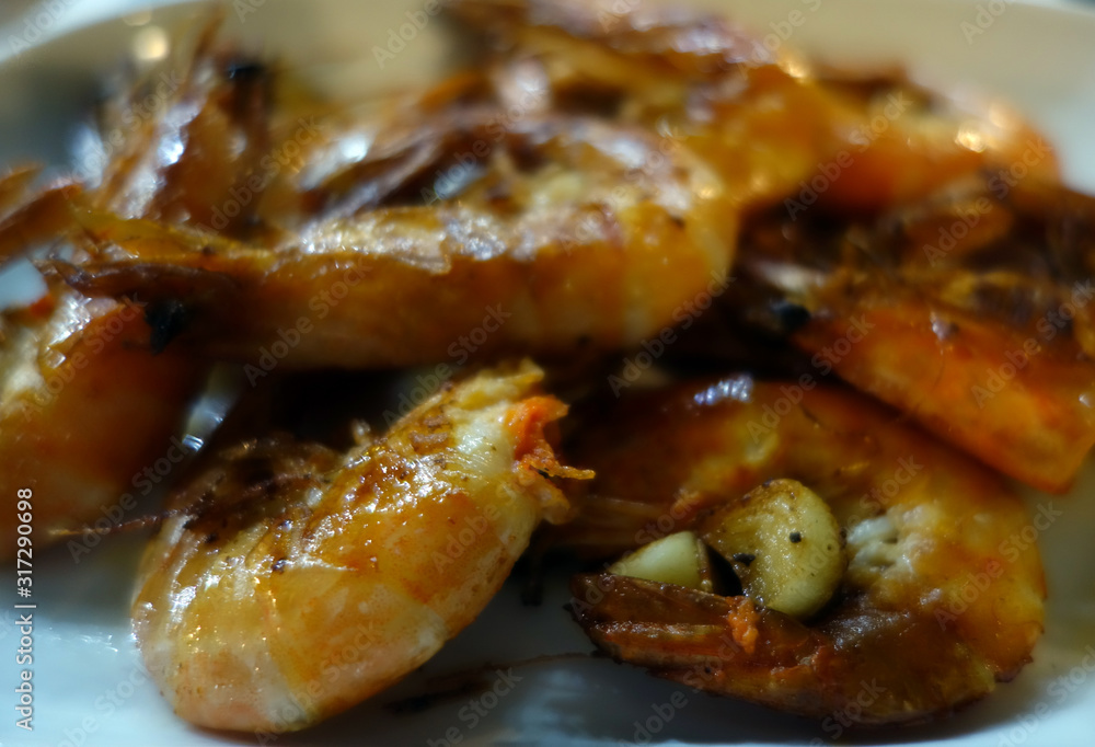 grilled tasty shrimps close-up with blur effect. grilled tasty shrimps close-up with blur effect.