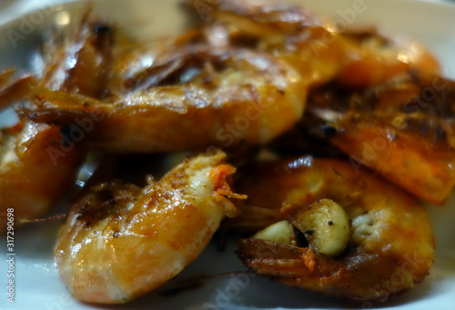 grilled tasty shrimps close-up with blur effect.