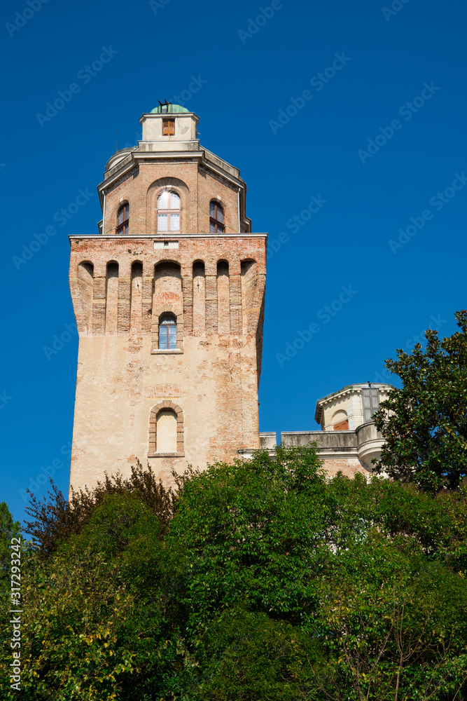 tower of Astronomical Observatory of Padua, Italy. Against blue sky