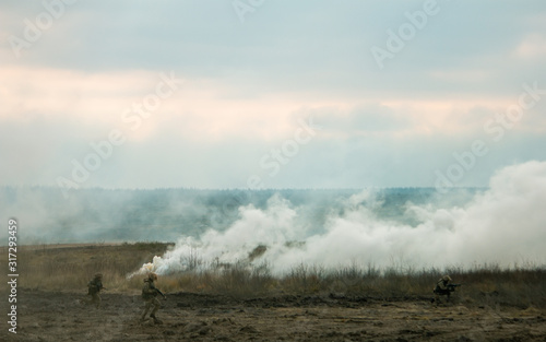 Hostilities. War concept. Military training ground with the explosions.